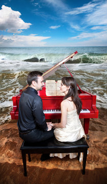 Couple near the piano on the beach