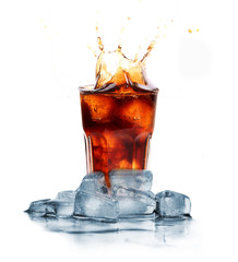 Cola with ice cubes splashing