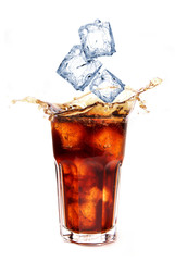 Cola with ice cubes splashing