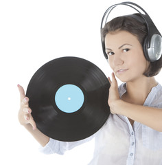 emotional brunette in headphones with vinyl record over white