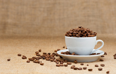 White cup with coffee grains