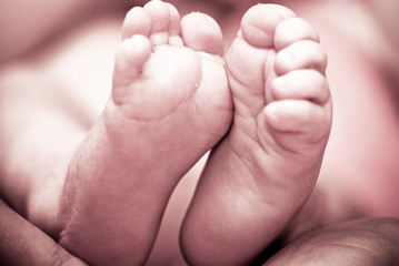 Baby's foot in mother hands