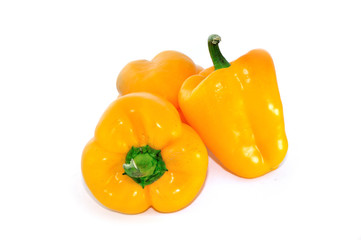 Three fresh yellow sweet pepper isolated on white background