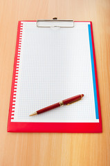 Binder with blank page with pen