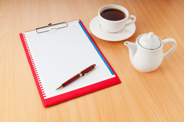 Binder with blank page and tea