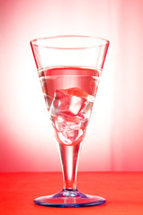 Water in the glass against gradient background
