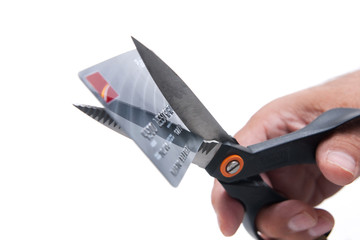 Scissors cutting credit card