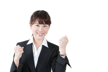 ガッツポーズをする女性