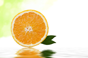 orange slice isolated on white background with green leaves