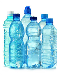 Polycarbonate plastic bottles of mineral water isolated on white