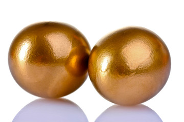 golden eggs isolated on white