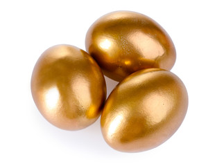 Obraz premium golden eggs isolated on white