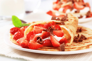 Crepes with sweet cheese and strawberries