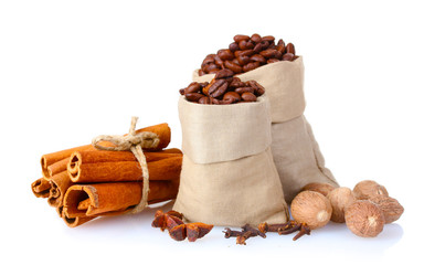 cinnamon, coffee and nutmeg isolated on white