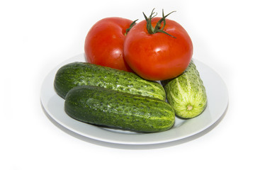 tomatoes, cucumbers on white plate