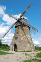 Fototapeta na wymiar Traditional stone Windmill