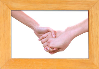 holding hands in wood frame isolated on white background