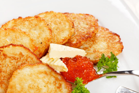 fried potatoes pancakes with caviar
