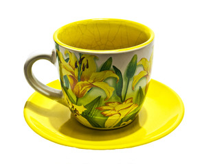 Cup with yellow lilies
