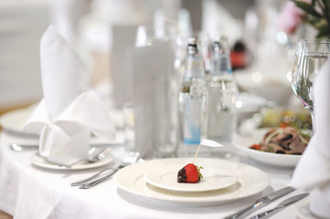 Empty strawberry place card on a festive table