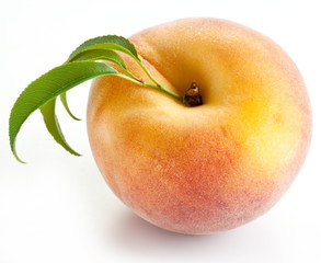 Ripe peach with leaves
