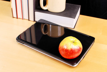 Apple on Laptop Computer