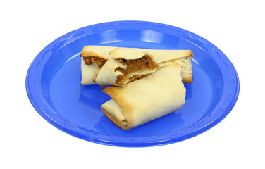 Bitten burrito on blue plate.