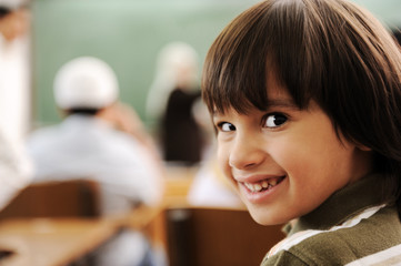 Happy child in classroom