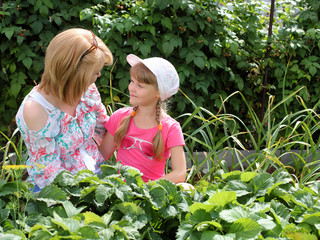 Mother and daughter gardening together