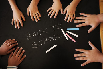 Back to school board with hands