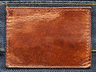 Blank leather label an jeans