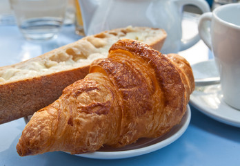 Breakfast with coffee and croissants