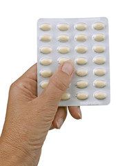 Hand with HRT - hormone replacement therapy tablets, isolated ov