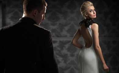 Handsome couple in a dark room