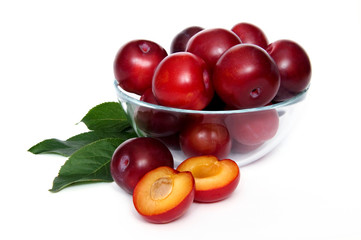 plums in a glass bowl