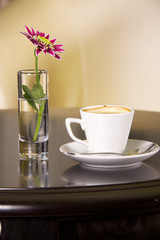 Cup of coffee with flowers