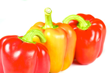 Orange and red pepper isolated on white