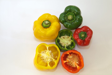 red yellow and green pepper whole and cut