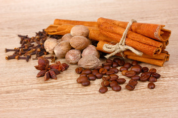 cinnamon and coffee on wooden background