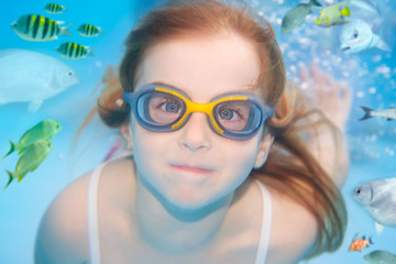 children girl underwater goggles swimming underwater