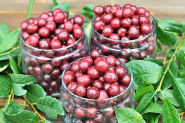Cherries in glass jars.