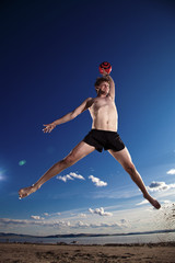 male beach volleyball game player jump in blue sky