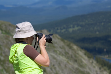 Nature photographer  on  mountain