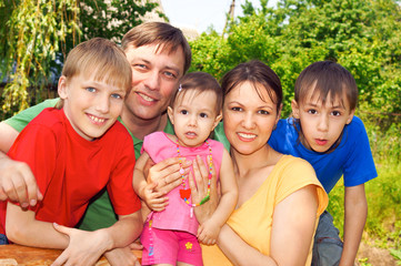 cute family at nature