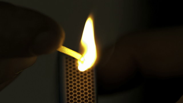 Lighted match in the dark in Slow motion