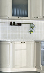 Bright interior with kitchen cabinets and wall tiles