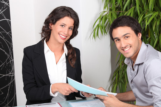 Portrait of a man and a woman in a meeting