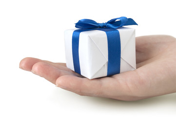 gift box with blue ribbon in hand isolated on white