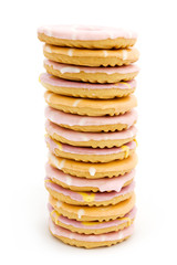 Tower of iced biscuits over white