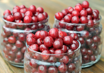 Cherries in glass jars.